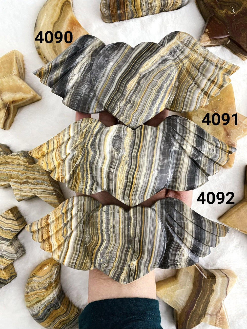 Banded Calcite Carved Heart with Wings - Uncommon Rocks