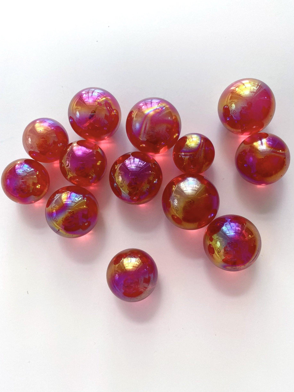 Aura Red Quartz Spheres - Uncommon Rocks